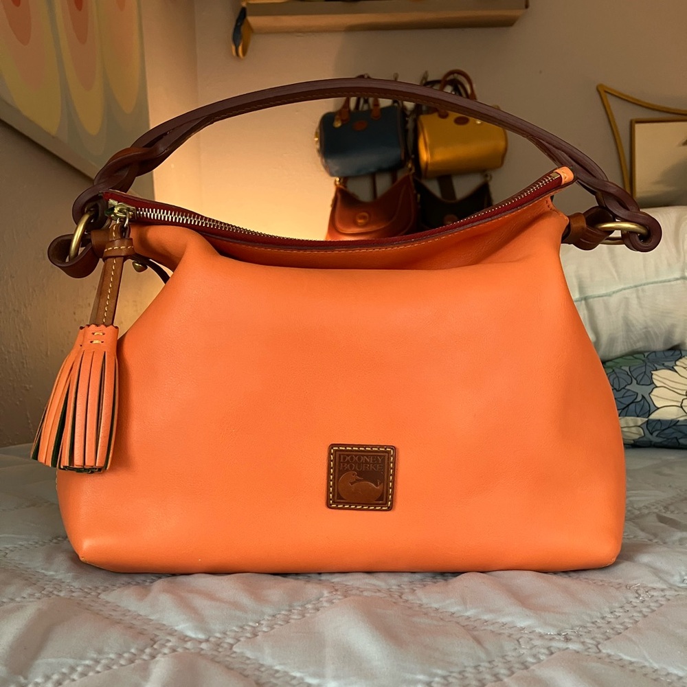 Dooney & Bourke Twist Strap in Salmon